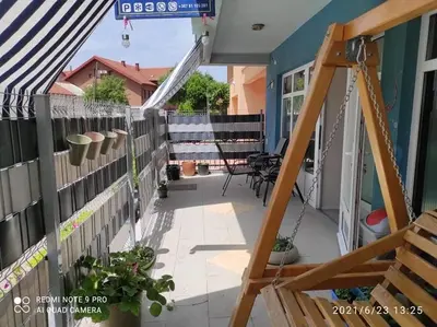 a balcony of a house with a fence at Adna Art Apartment in Bihać