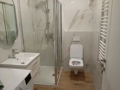 a bathroom with a shower and a toilet and a sink at Apartman Teo in Banja Luka