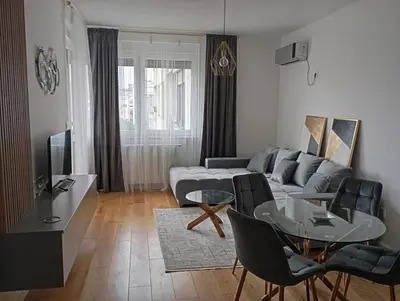 a living room with a couch and a table at Apartman Teo in Banja Luka