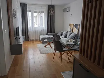 a living room with a couch and a table at Apartman Teo in Banja Luka