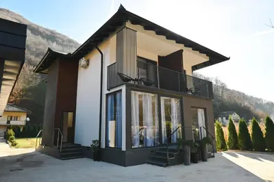 a building with a balcony on the side of it at Villa Fluviale in Jezero