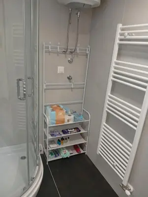 a bathroom with a shower and a walk in closet at Beatiful BL in Banja Luka