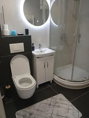 a bathroom with a toilet and a shower and a sink at Beatiful BL in Banja Luka