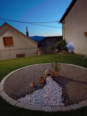 a small pond in the backyard of a house at Apartment M in Livno