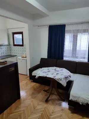 a living room with a couch and a table at Happy in Banja Luka