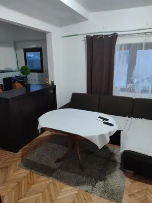 a living room with a coffee table in front of a couch at Happy in Banja Luka