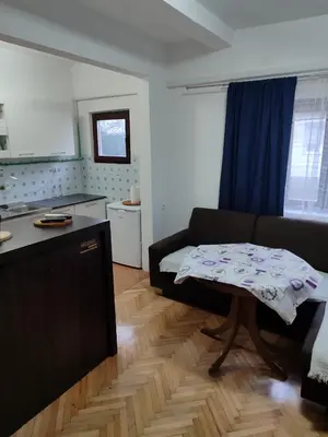 a living room with a couch and a table at Happy in Banja Luka
