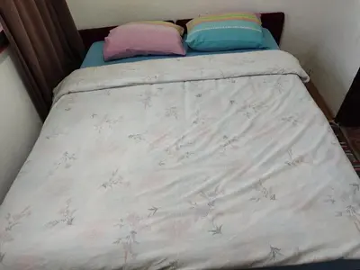 a bed with two pillows on top of it at Happy in Banja Luka