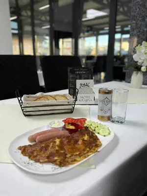 a plate of food on a table with a plate of food at Motel i Restoran Krajina in Cazin