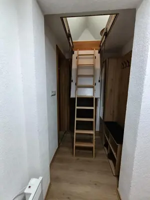 a room with a ladder and a bunk bed at Divan Vlašić in Šišava
