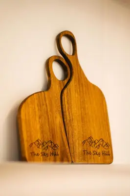 two wooden spoons sitting on top of a wall at The Sky Hill - luxury chalet in Kupres
