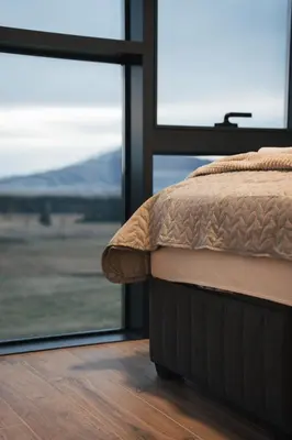 a bedroom with a bed and a large window at The Sky Hill - luxury chalet in Kupres