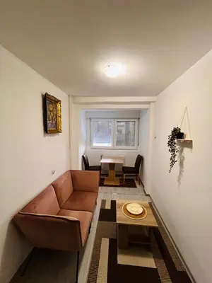 a living room with a couch and a table at Apartman Buric