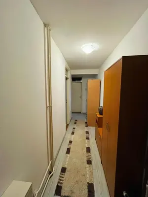 an empty hallway with a hallway at Apartman Buric