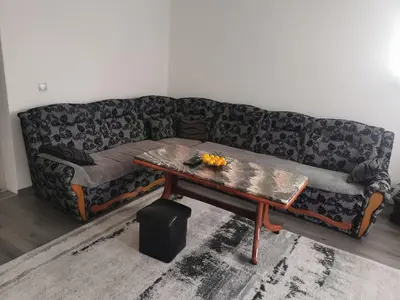 a living room with a couch with a coffee table at smještaj Visoko in Visoko