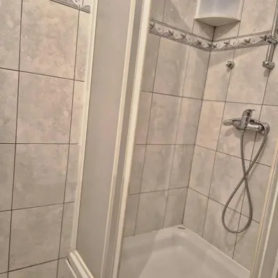 a bathroom with a shower with a shower head at Livno Sympan in Livno