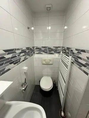 a small bathroom with a toilet and a sink at Banja Luka Arcadia in Banja Luka