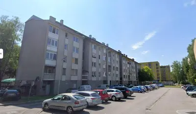 a row of cars parked in front of a building at Apartman BRKO in Bihać