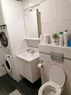 a small bathroom with a toilet and a sink at Apartman 44, Mejdan, Banja Luka in Banja Luka