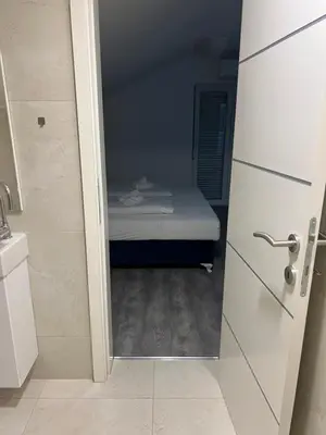 a small bedroom with a small bed in a room at DM Rooms l in Gornji Vakuf