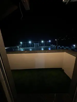 a view of a city at night with lights at DM Rooms l in Gornji Vakuf