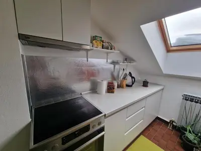 a kitchen with a sink and a stove top oven at Apartman Sofija 3 in Starčevica