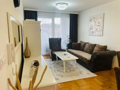 a living room with a couch and a table at Apartman Klara Banja Luka in Banja Luka