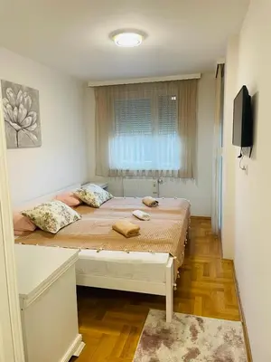 a bedroom with a bed with two towels on it at Apartman Klara Banja Luka in Banja Luka