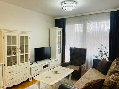 a living room with a couch and a tv at Apartman Klara Banja Luka in Banja Luka