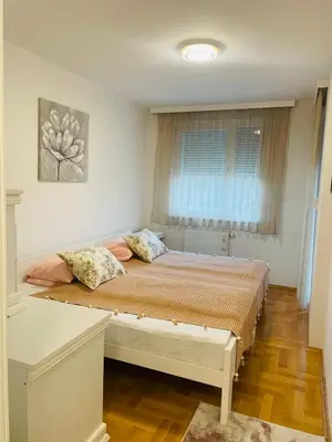 a bedroom with a large bed in a room at Apartman Klara Banja Luka in Banja Luka