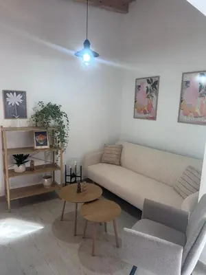 a living room with a couch and a table at Villa Perla in Prijedor