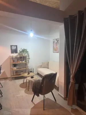 a living room with a couch and a table at Villa Perla in Prijedor