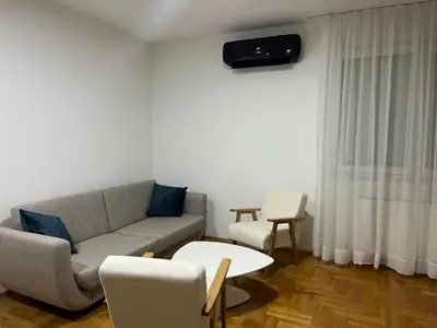 a living room with a couch and a table at Apartman Dona in Banja Luka