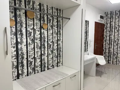 a bathroom with a black and white wall at Apartman Dona in Banja Luka