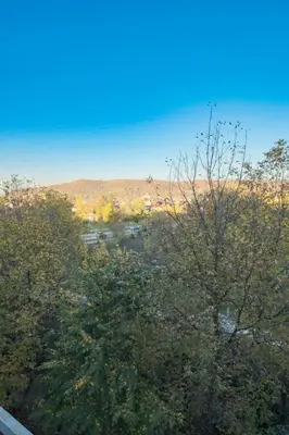 a view of a valley with trees and a river at Banja Luka Lux in Banja Luka