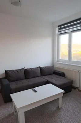 a living room with a couch and a coffee table at Banja Luka Lux in Banja Luka