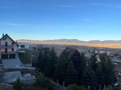 a view of a town with mountains in the background at Aurea Vista in Kupres