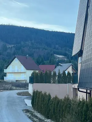 a street in a town with houses and trees at Aurea Vista in Kupres