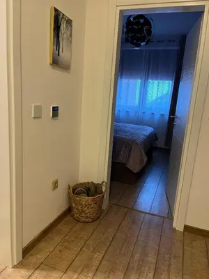 a hallway with a room with a bed and a basket at Aurea Vista in Kupres