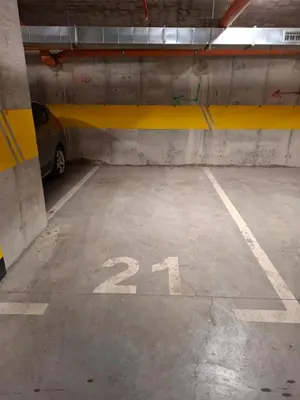 a parking garage with a car parked in it at Apartman MYKA sa privatnim parkingom in Banja Luka