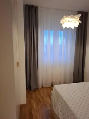 a bedroom with a bed and a window at Apartman MYKA sa privatnim parkingom in Banja Luka