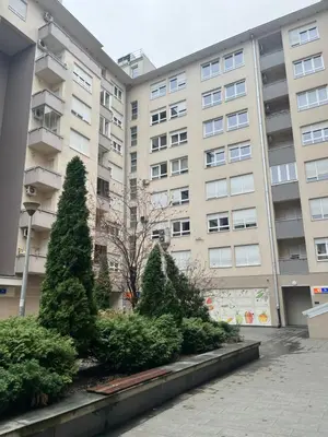 a row of trees in front of a building at Hogar Cálido in Banja Luka