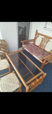 a pair of chairs and a table with a glass top at Stan Banja Luka Nova Godina in Krndija