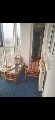 two beds in a room with a window at Stan Banja Luka Nova Godina in Krndija