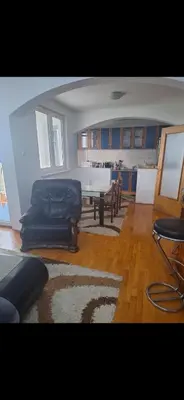 a living room with a table and a couch at Stan Banja Luka Nova Godina in Krndija