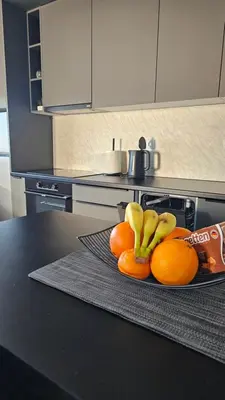 a plate of oranges and bananas on a kitchen counter at Stan na dan Jović in Modriča