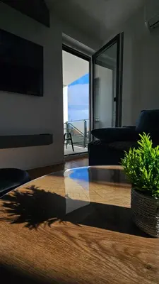 a living room with a couch and a table at Stan na dan Jović in Modriča