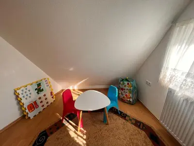 a small room with a table and two chairs at Planinska Draga Vlašić in Vlasic