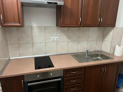 a kitchen counter with a sink and a stove at Planinska Draga Vlašić in Vlasic