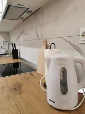 a white coffee maker sitting on a kitchen counter at Apartment Kesten Banja Luka in Banja Luka